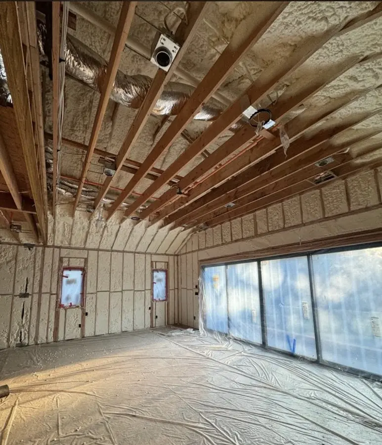 Interior walls and ceiling insulated with spray foam during new construction in New Hanover